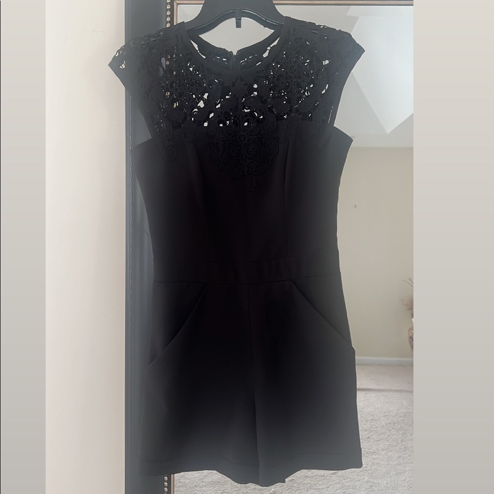 Never worn jumpsuit size 2 fits like a small size